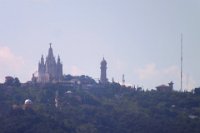 The Tibidabo amusement park and Temple Expiatori del Sagrat Cor from the roof of the Casa Mila La Pedrera