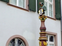 Public water pump with the town insignia